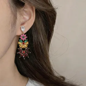 Close-up view of vintage style multi-color floral crystal tassel earrings for women