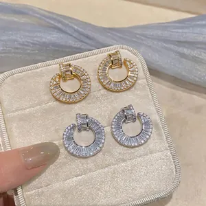 Elegant 18K gold-plated silver needle round stud earrings with sparkling baguette zircons
