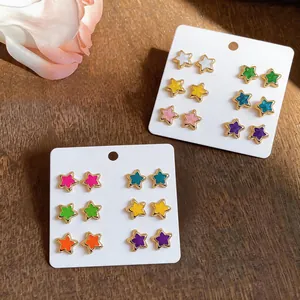 Collection of colorful star-shaped stud earrings with silver pins in dopamine colors