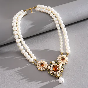 Vintage double-layer resin pearl necklace with gold flower pendants and orange stones