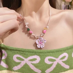 Sweet cherry blossom beaded necklace with 3D flower pendant on model