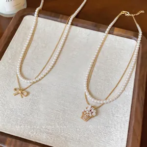Elegante collana di perle a doppio strato con cesto di fiori in zircone e fiocco