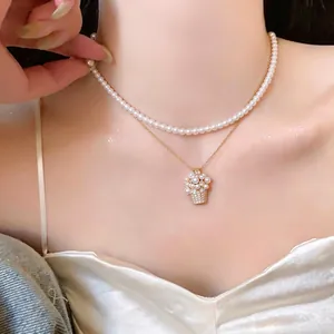 Collana a doppio strato in perle stile francese con pendente a cesto di fiori zircone