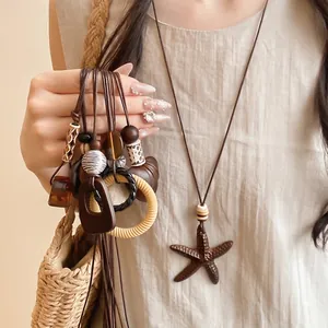 Vintage leather cord necklace featuring resin wood beads and large starfish pendant