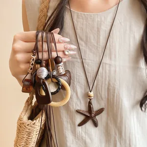 Detail view of vintage leather cord necklaces with starfish and resin bead pendants
