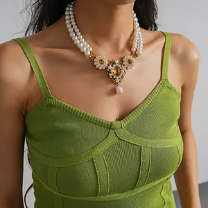 Detailed view of a vintage court style double-layer pearl necklace on a model