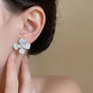 Elegant Korean style silver flower stud earrings with pearl center for women