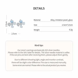Detail view of blue flower stud earrings with size and material specifications.