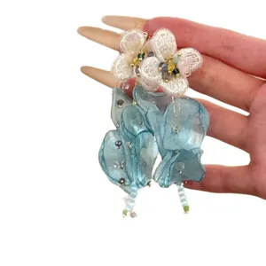 Elegant handmade white and blue chiffon flower tassel earrings featuring delicate bead details