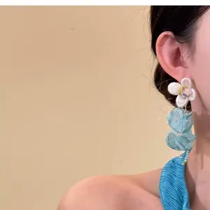 Elegant chiffon flower tassel earrings worn on ear for a sweet aesthetic