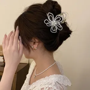 Elegant pearl flower hair claw clip for women with sophisticated floral design
