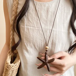 Vintage resin starfish pendant necklace on a leather cord, lifestyle close-up detail.