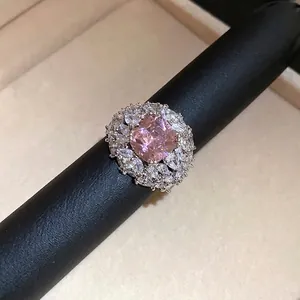 Elegant silver open ring with a square pink zircon center and marquise halo crystals.