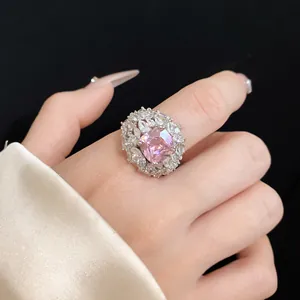 Detailed macro shot of an elegant silver ring featuring a large pink zircon center stone