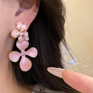Elegant pink enamel flower drop earrings with rhinestones and silver needles