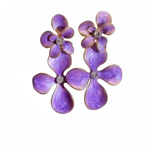 Elegant purple enamel flower drop earrings with sparkling rhinestones in center