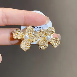 Elegant flower stud earrings with pearls and zircon stones, silver needle design