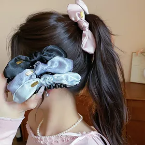 Elegant satin bow hair claw clips for women showing multiple colors and satin texture