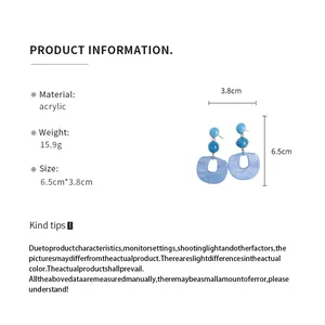 Detailed product information for blue acrylic oval dangle earrings showing 6.5cm height
