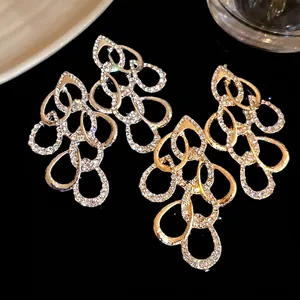 Elegant silver and gold waterdrop dangle earrings with full rhinestone embellishment