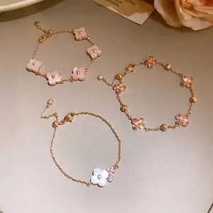 Elegant pink shell flower bracelets with zircons for a luxury summer vacation style.