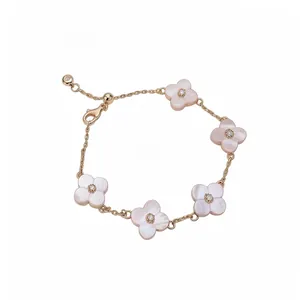 Elegant rose gold bracelet featuring pink mother-of-pearl flowers with zircon centers