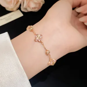 Detailed close-up showing a sweet cherry blossom pink zircon flower bracelet on a wrist