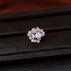 Detailed view of a sparkling zircon cluster ear clip for non-pierced ears in silver finish