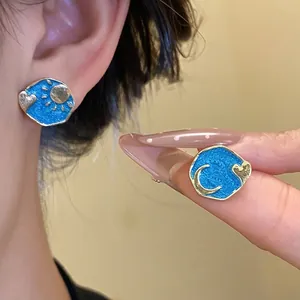 Elegant vintage enamel sun moon heart stud earrings in deep blue and gold finish