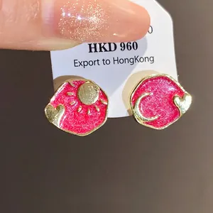 Vintage court style enamel stud earrings featuring gold sun moon and heart motifs