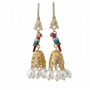 Elegant gold-tone parrot drop earrings with cubic zirconia and pearl tassels