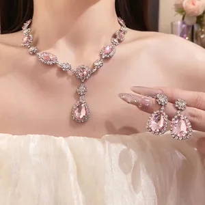 Luxurious pink crystal necklace and pear-shaped earring set with brilliant rhinestones