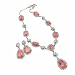 Elegant pink teardrop pendant necklace and earrings set with sparkling stones