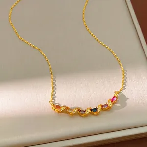 Elegant gold twisted necklace with sparkling multicolored zircon stones