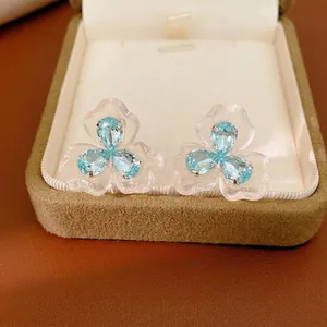 Elegant light blue resin flower stud earrings with zircon stones and 925 silver needles
