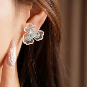 Elegant blue resin flower stud earrings with sparkling zircon stones and silver needles