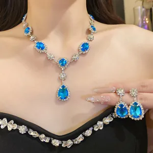 Elegant teardrop blue crystal necklace and earrings set for women's evening wear