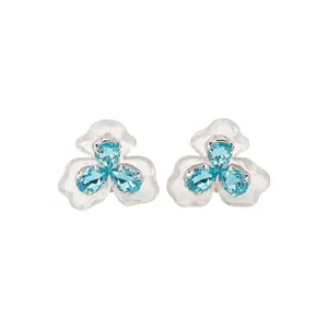 Elegant blue resin flower stud earrings with sparkling teardrop zircons, front view.