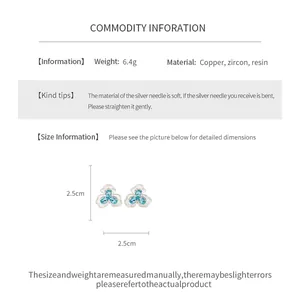Detailed view of blue resin flower stud earrings showing 2.5cm dimensions and material specs