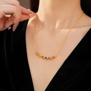 Close-up of a gold twisted necklace featuring vibrant multi-color zircon stones.