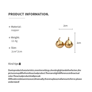 Detail showing brushed gold semi-circle earrings with 2cm dimensions and material specs.