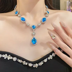 Elegant silver-tone necklace featuring blue water-drop and oval rhinestones detail