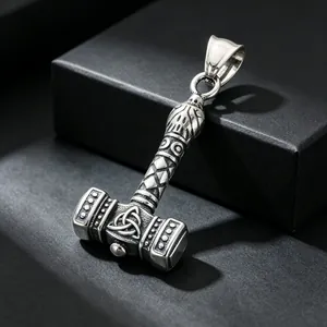Close-up of a vintage stainless steel Thor's Hammer Mjölnir pendant with Celtic knotwork