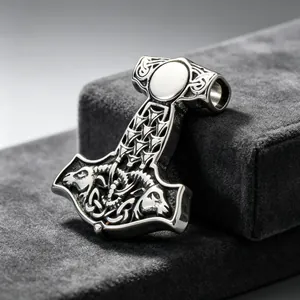 Macro detail of Nordic Viking Thor's Hammer pendant with intricate steel carvings