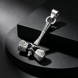 Macro view showing intricate skull detail on vintage stainless steel Viking Mjolnir pendant