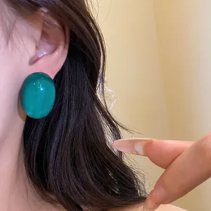 Elegant dark green resin elliptical stud earrings with 925 silver needles for women