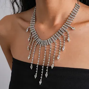 Close-up detail of silver rhinestone fringe necklace with water drop tassels