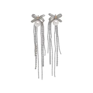 Elegant silver bow earrings with pearls and long delicate chain tassels for women