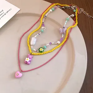 Sweet three-layer beaded necklace with colorful resin heart, bear, and butterfly charms