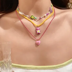 Charming layered necklace set with colorful beads, resin gummy bear and heart pendants